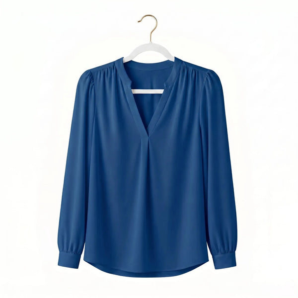 Blue long-sleeve blouse displayed on a white coat hanger against a plain background