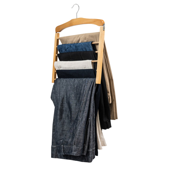 Wooden multi-tier pants hanger holding assorted trousers on white background