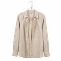 Beige shirt on a hanger against a white background