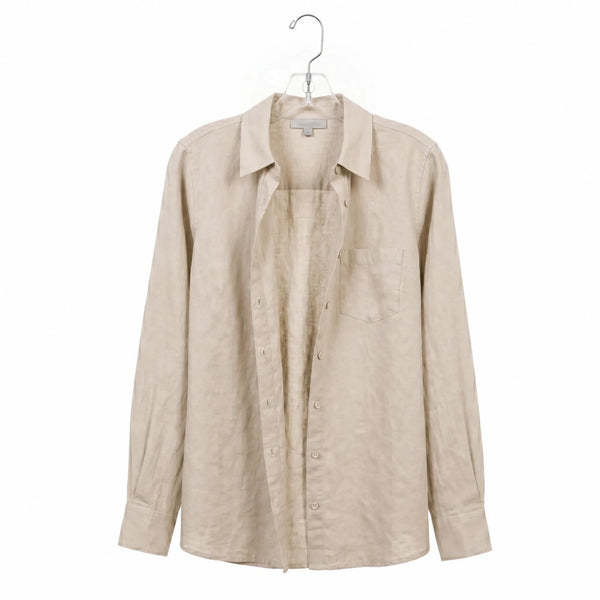 Beige shirt on a hanger against a white background