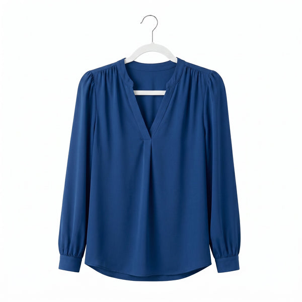 Blue blouse on a white hanger against a white background