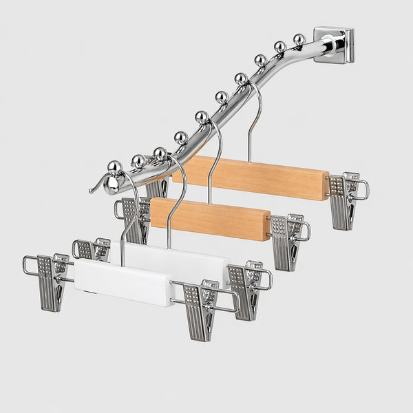 Clothespin rack with wooden hangers on a white background