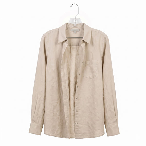 Beige shirt on a hanger against a white background
