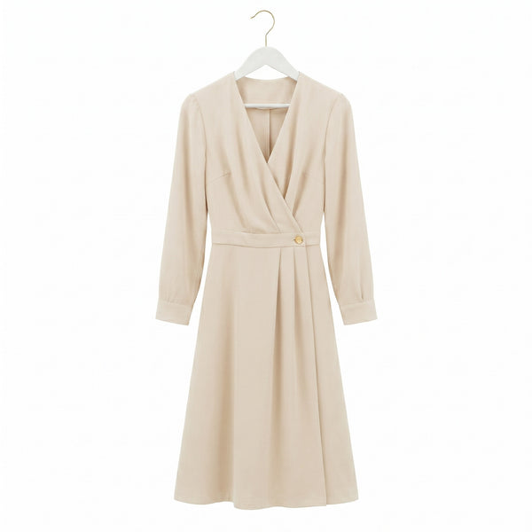 Cream colour women dress hang on a white wood suit hanger with gold hook