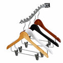 Set of wooden and metal hangers with clips on a white background