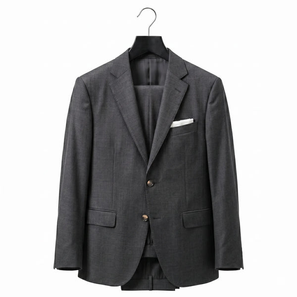 Gray blazer on a hanger against a white background