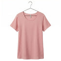 Pink t-shirt on a hanger against a white background