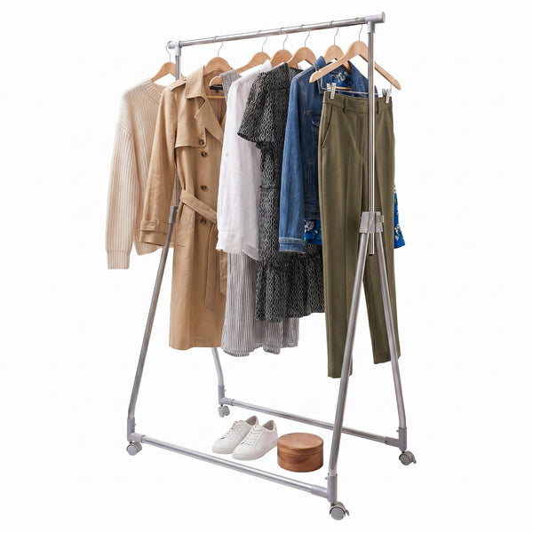 Clothing rack with various garments on a white background