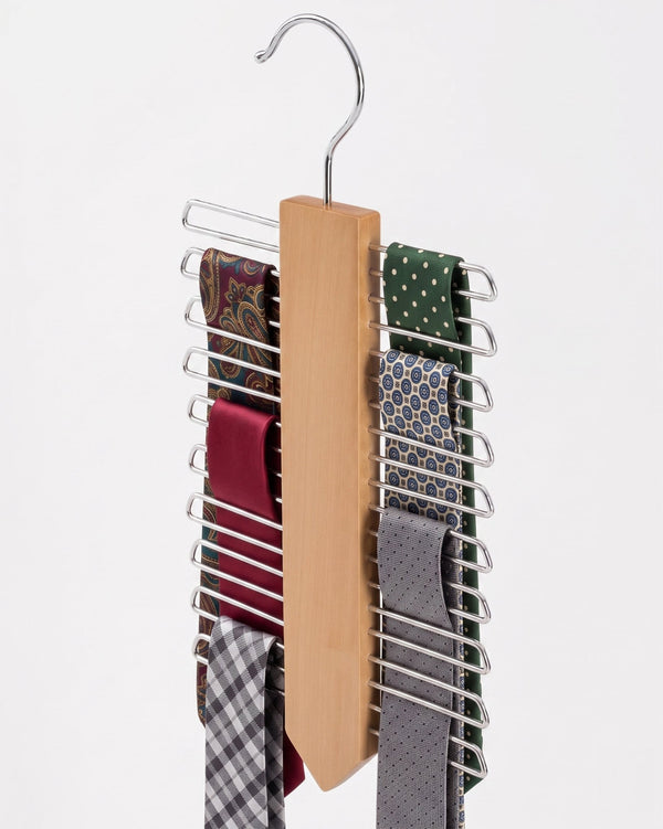 Tie rack with multiple ties on a white background