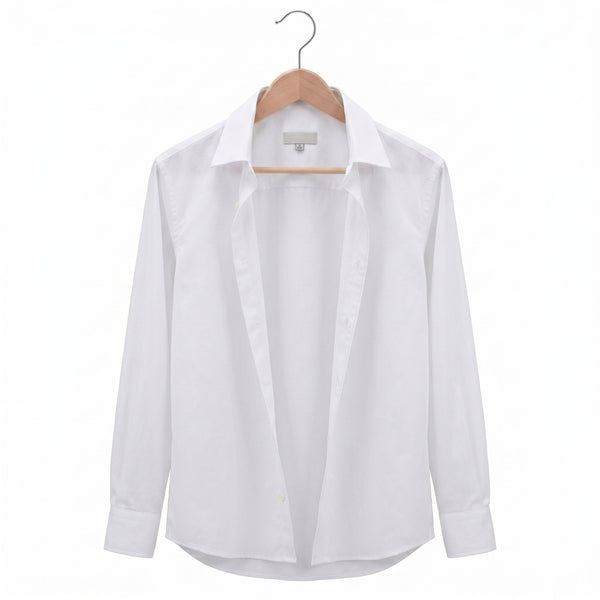 White shirt on a wooden hanger against a white background